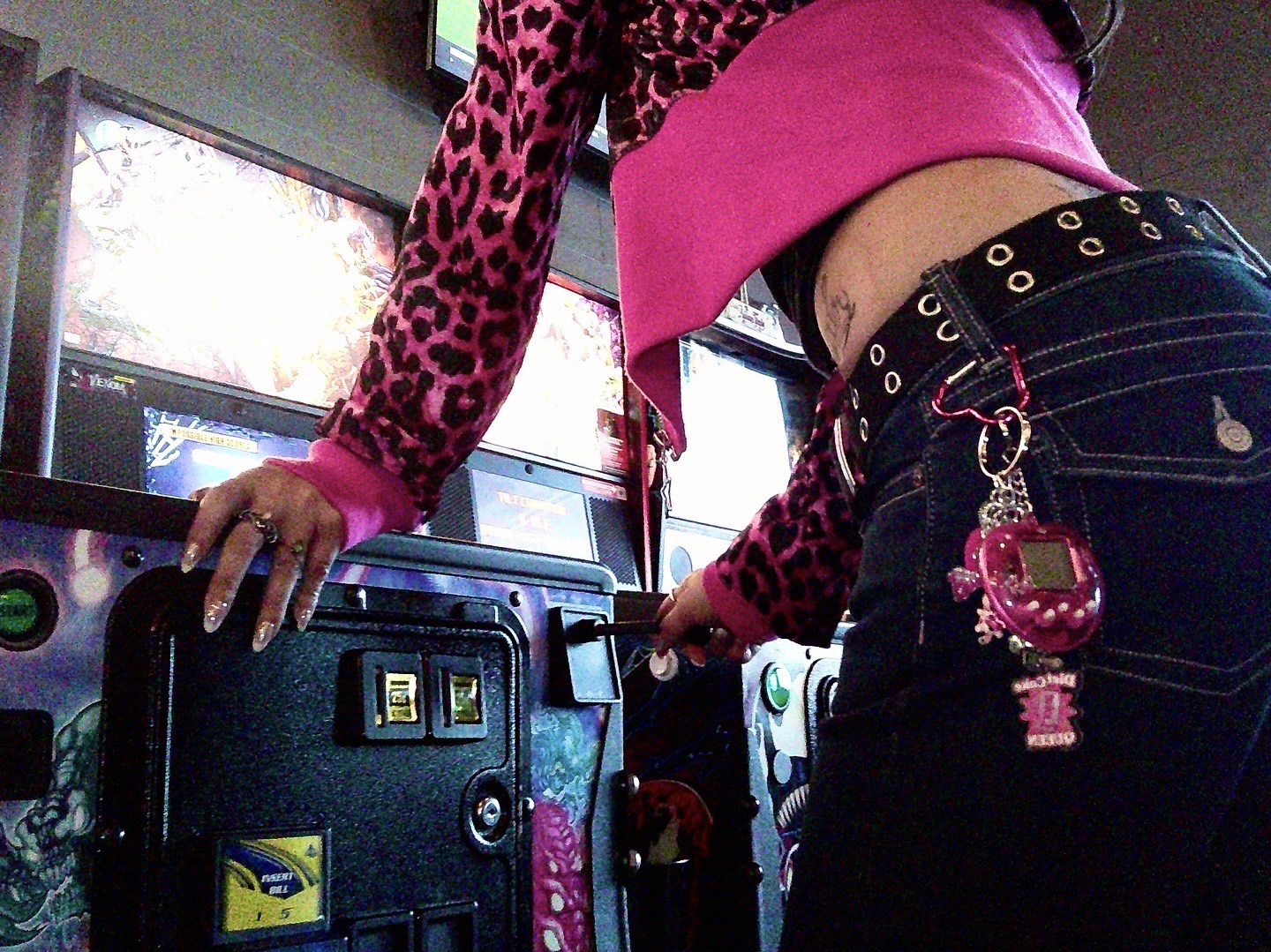 Lifestyle photo - bent over pinball machine