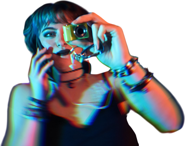 Close-up of a model holding a digital camera charm to her eye